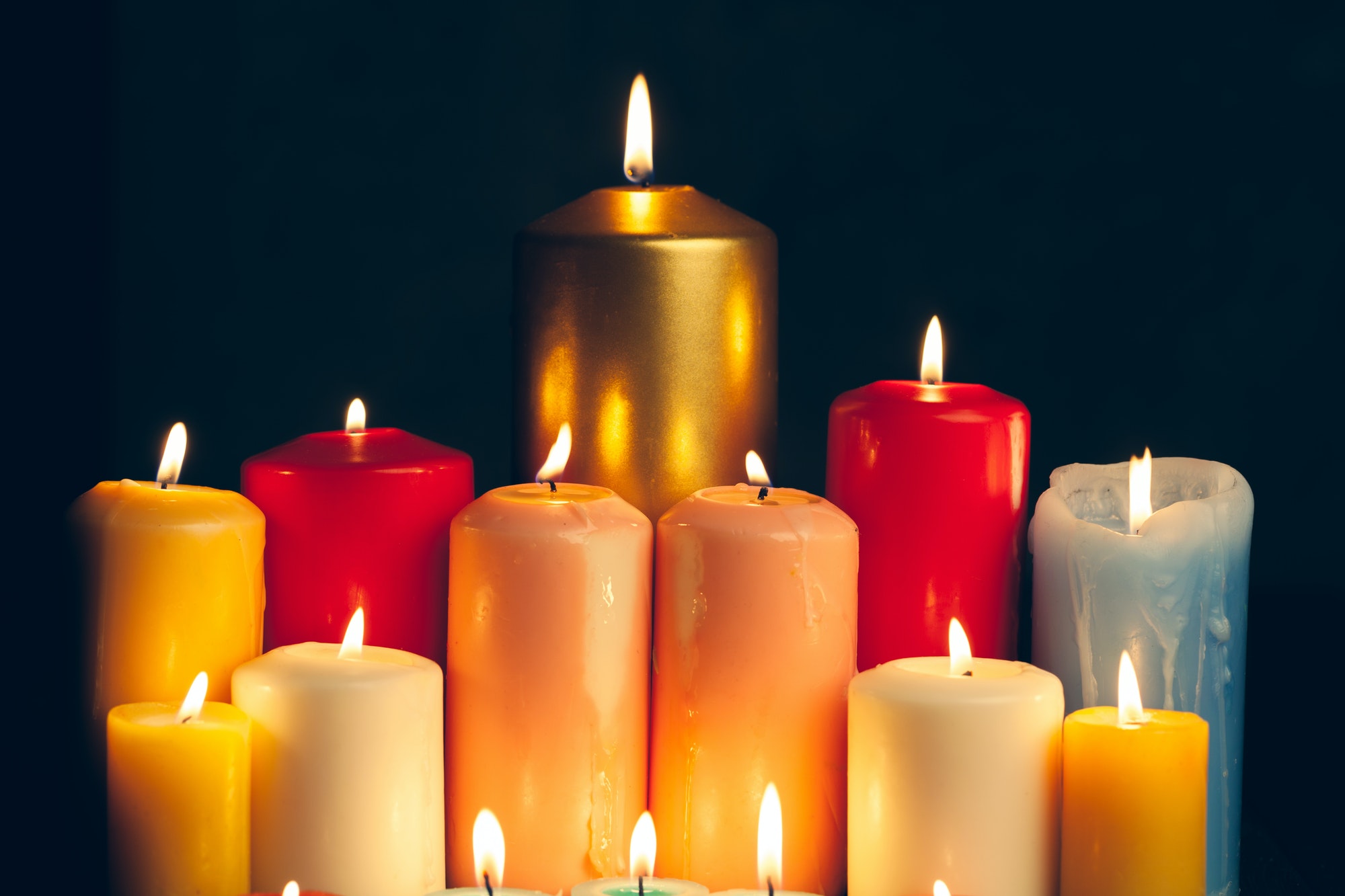 candles-burning-in-darkness-over-black-background-commemoration-concept.jpg